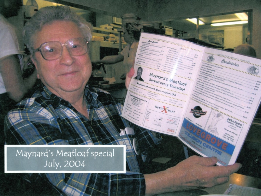 Maynard Drawson holding a White’s Restaurant menu featuring Maynard’s Meatloaf special. Photo Credit: Willamette Heritage Center 2007.050.0002