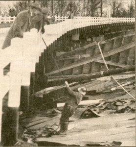 Jerry Farrar, superintendent for the highway department examines the wreckage of the Mellow Moon Skating Rink. Photo Credit: Statesman Journal – Al Lightner photographer 