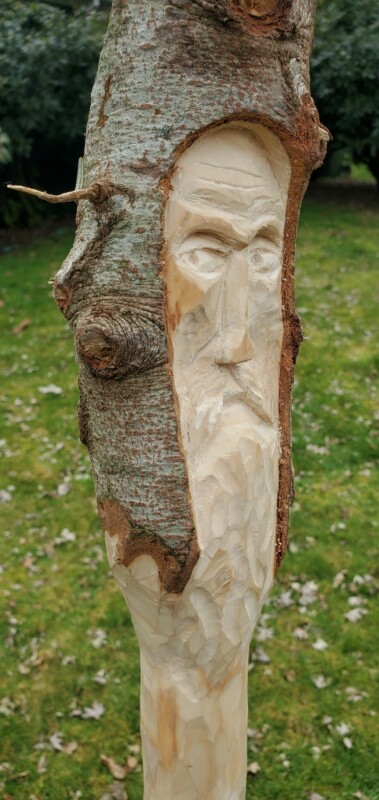 Walking stick with carved Spirit close up