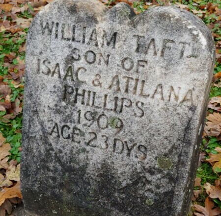 Grave stone with inscription William Taft Son of Isaac & Atilana Phillips 1909. Age 23 Days