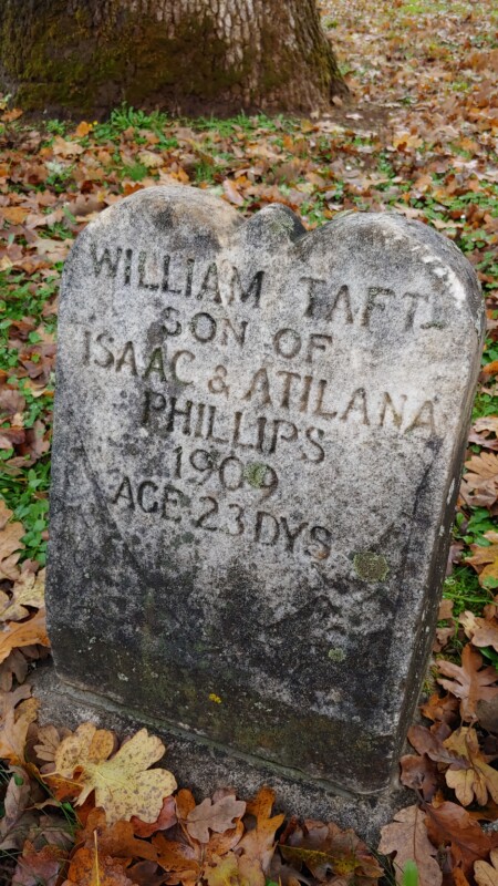 Grave stone with inscription William Taft Son of Isaac & Atilana Phillips 1909. Age 23 Days